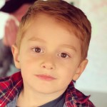 5-year-old model in tee and red flannel